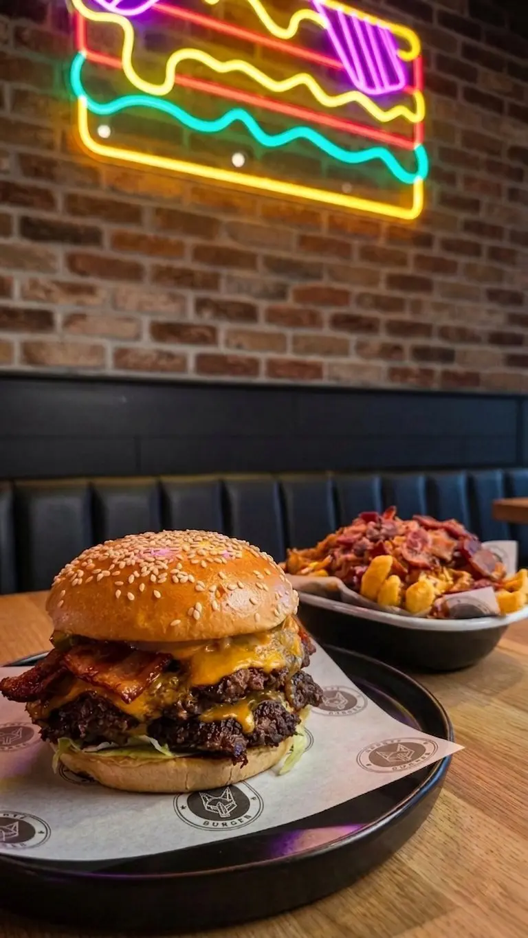 Double bacon cheeseburger and dirty fries served at Coyote Burger, Inverness